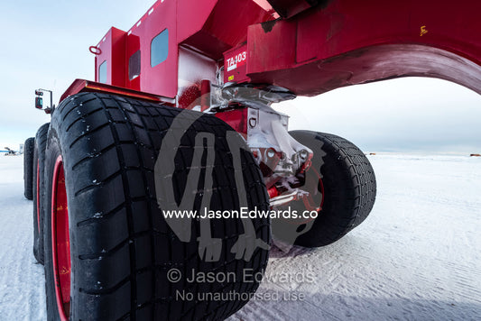 The tyre of the Kress, a large vehicle used to transport scientists and workers across the sea ice in Antarctica. Pegasus Field, Ross Island, McMurdo Sound, Antarctica.