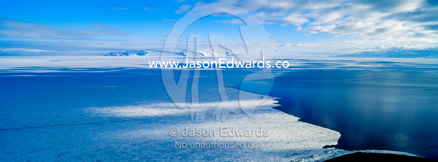 The melting edge of sea ice where it meets the open ocean during the Antarctic summer. Haskell Strait, McMurdo Sound, Ross Island, Antarctica.