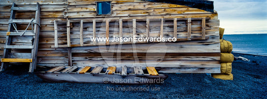 A weathered timber sled and ladder at the Antarctic explorer Robert Falcon Scott's hut. Scott's Hut, Cape Evans, Ross Island, Antarctica.
