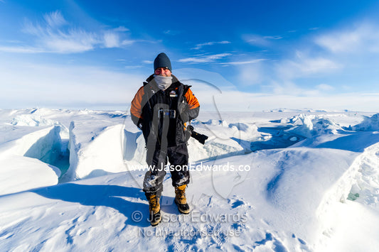 National Geographic photographer Jason Edwards on the sea ice in Antarctica. Pram Point, McMurdo Sound, Ross Island, Antarctica.