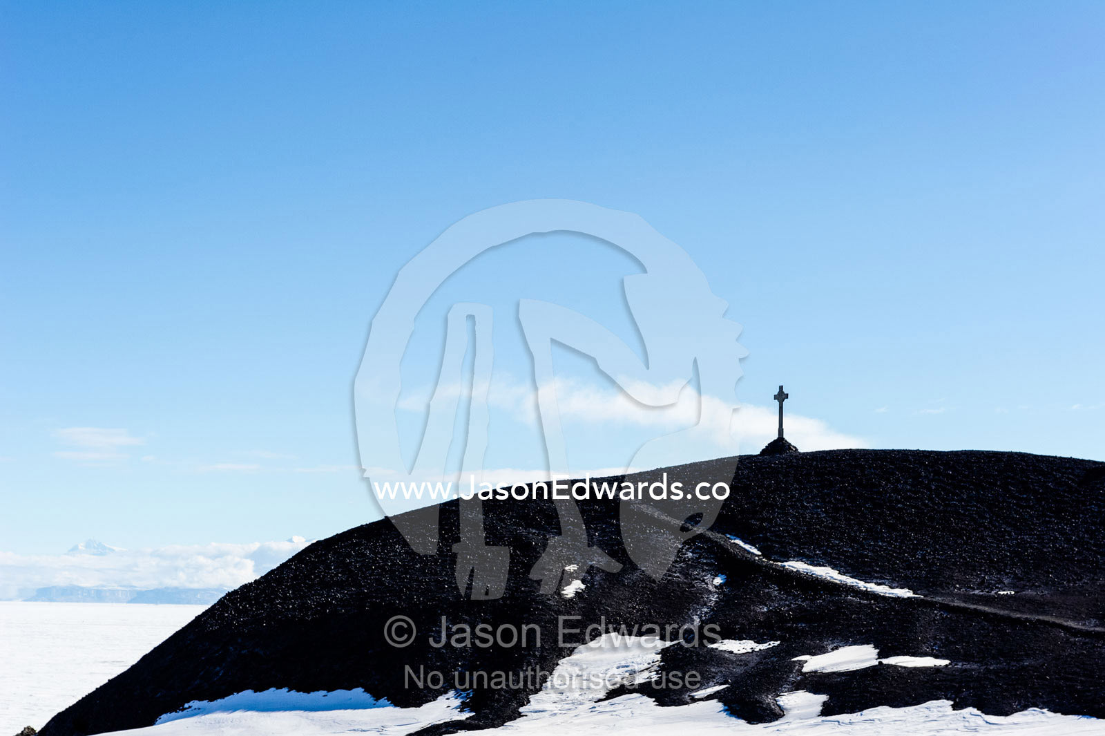 George Vince's Cross on the hill overlooking Discovery Hut in Antarctica. Discovery Hut, Hut Point, Ross Island, Antarctica.