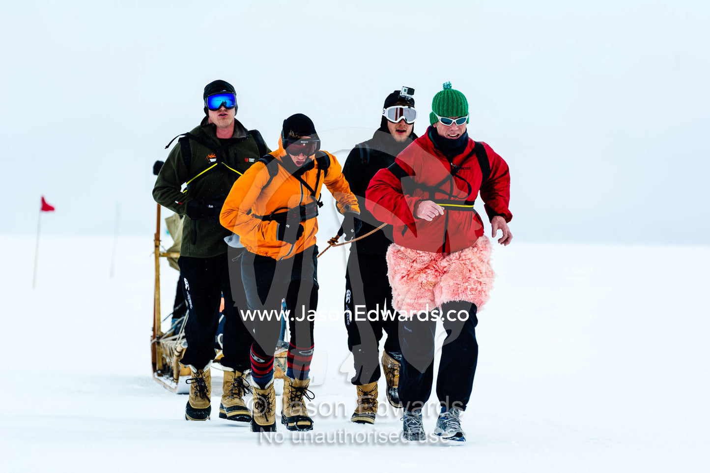 Teams of staff from Antarctic bases compete in a man haul race towing sleds across the frozen sea ice. Cape Armitage, McMurdo Sound, Ross Island, Antarctica.