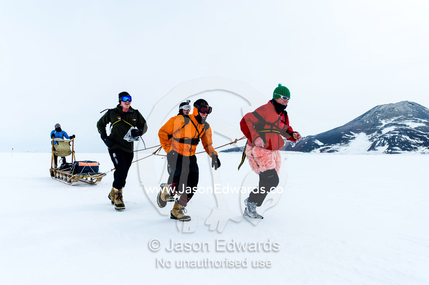 Teams of staff from Antarctic bases compete in a man haul race towing sleds across the frozen sea ice. Cape Armitage, McMurdo Sound, Ross Island, Antarctica.