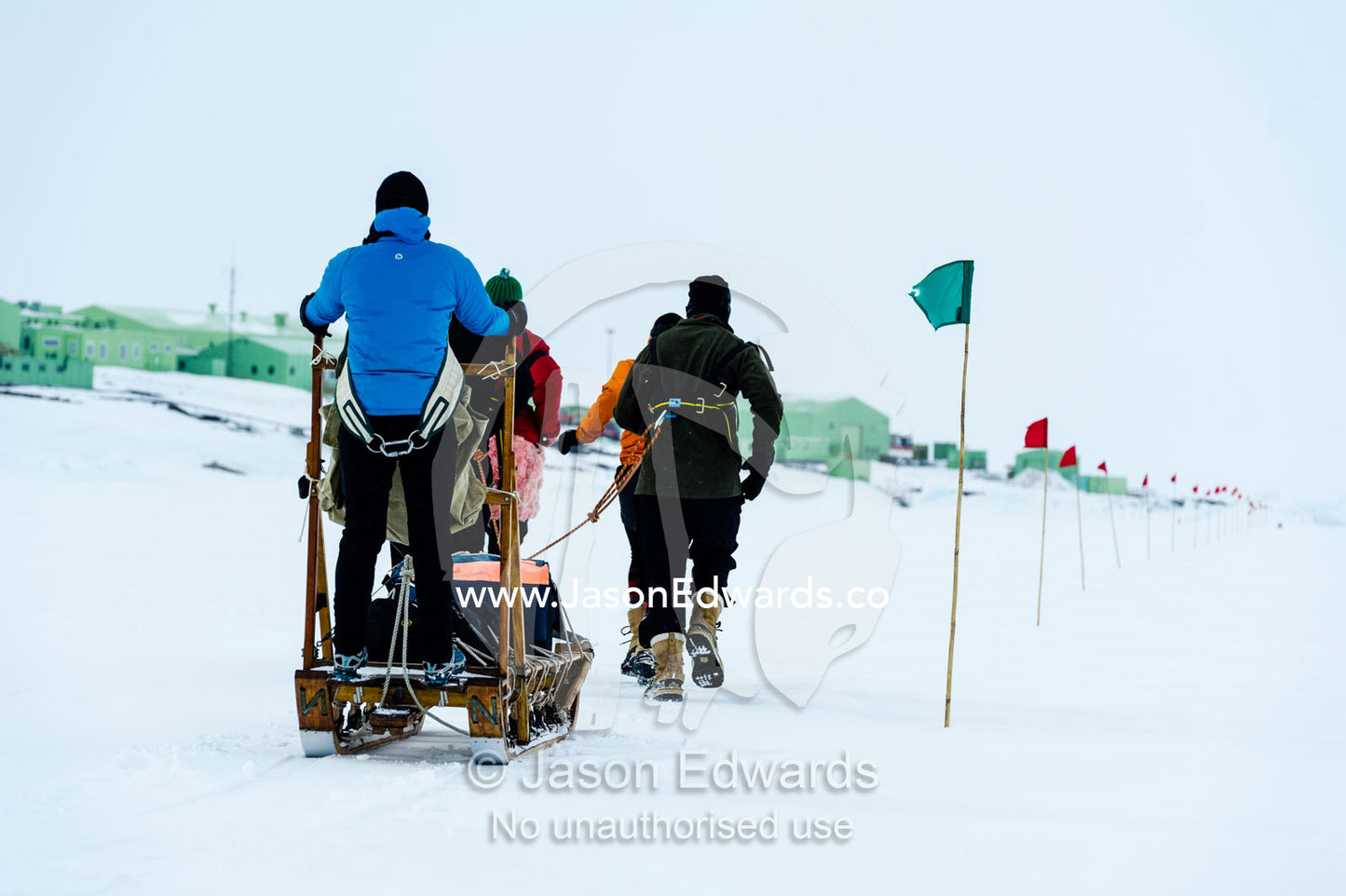 Teams of staff from Antarctic bases compete in a man haul race towing sleds across the frozen sea ice. Scott Base, Pram Point, Hut Point Peninsula, Ross Island, Antarctica.