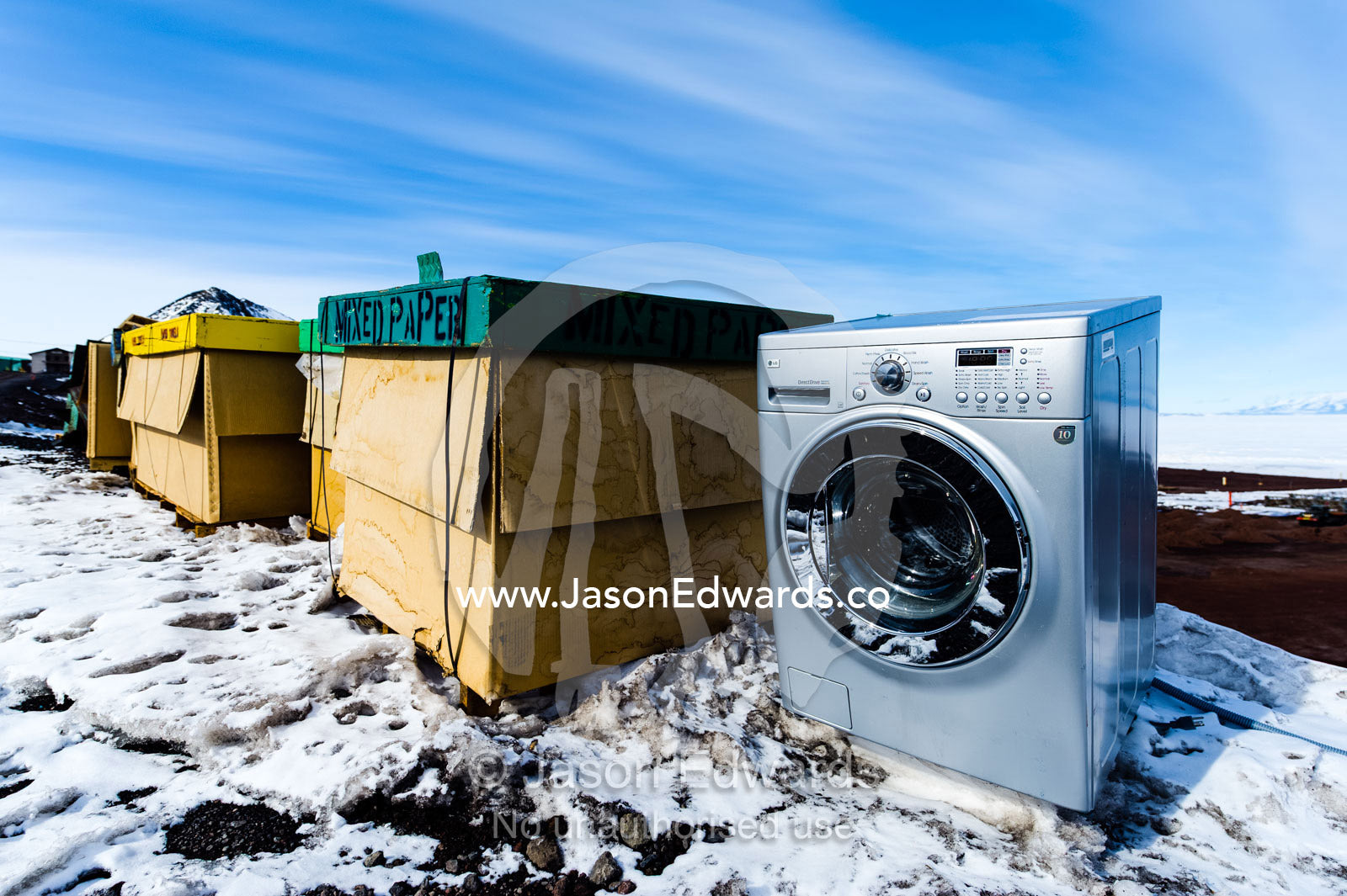 Garbage waste and recycling including a washing machine waiting to be shipped out of Antarctica. McMurdo Station, Ross Island, Antarctica.