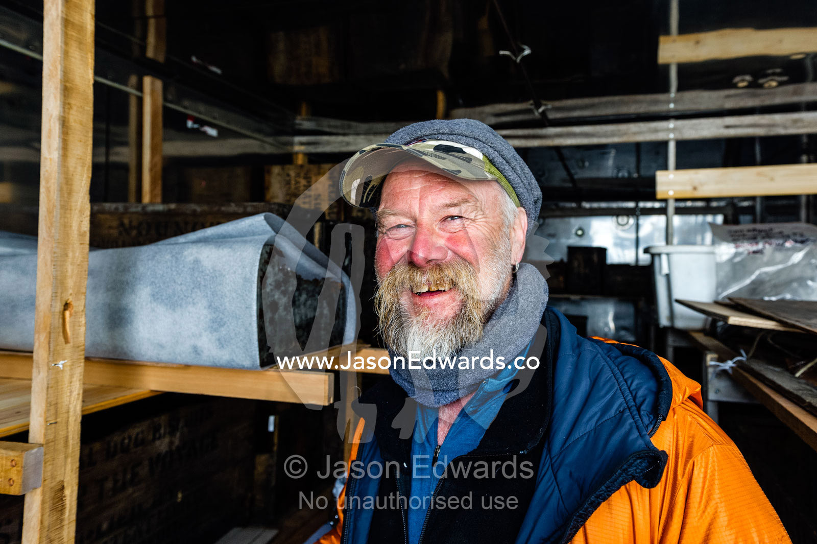 An expert from the Antarctic Heritage Trust working on Discovery Hut on Ross Island. Discovery Hut, Hut Point, Ross Island, Antarctica.
