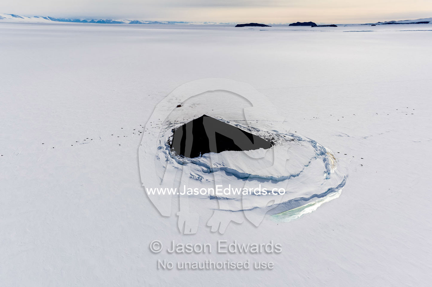 Sea ice pressure ridges rise along the shoreline of a small island in Antarctica. Turtle Rock, Erebus Bay, McMurdo Sound, Ross Island, Antarctica.