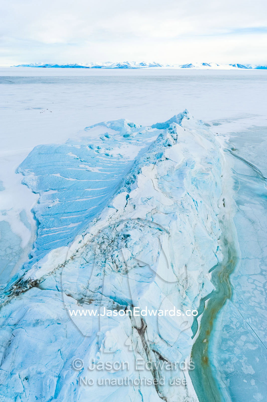 Tortured glacial ice debris separated from the glacier and fallen into the sea ice. Descent Cliffs, Erebus Bay, McMurdo Sound, Ross Island, Antarctica.
