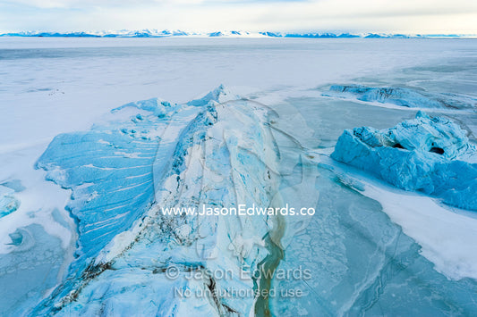 Tortured glacial ice debris separated from the glacier and fallen into the sea ice. Descent Cliffs, Erebus Bay, McMurdo Sound, Ross Island, Antarctica.