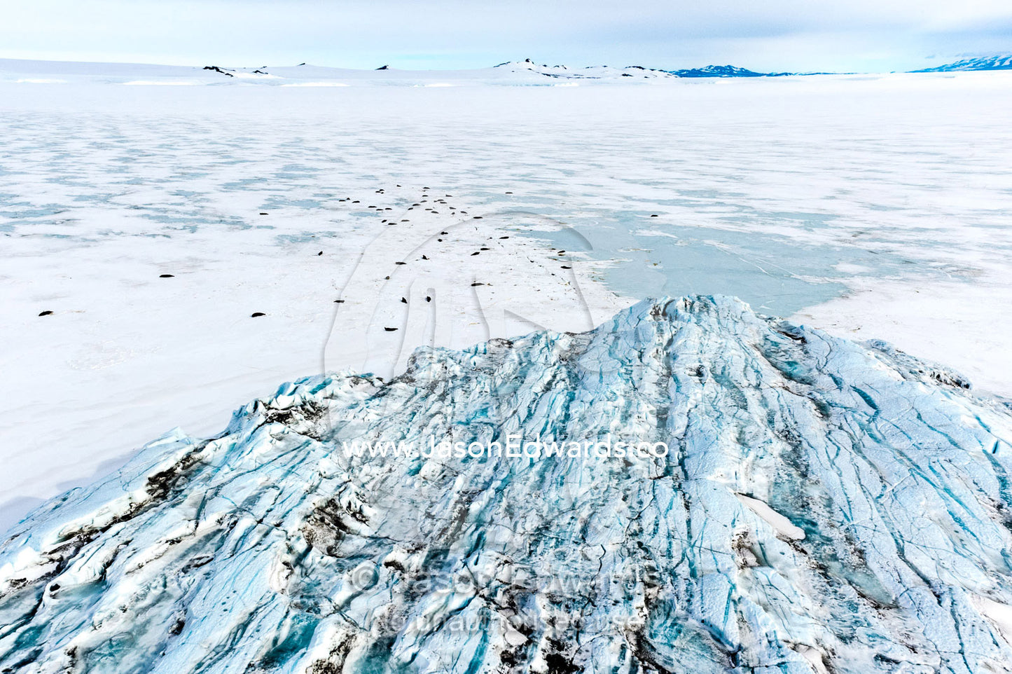 The fractured and tortured ice tongue of the Mt Erebus Glacier sweeps off the slopes of the active volcano. Pakaru Icefalls, South Bay, Ross Island, Antarctica.