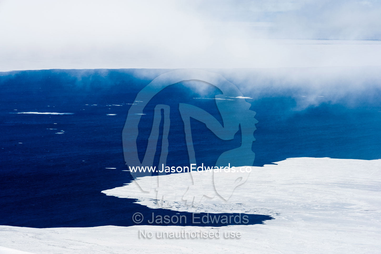 Open ocean lines the ice edge as sea ice melts in the Antarctic summer. McMurdo Sound, Ross Island, Antarctica.