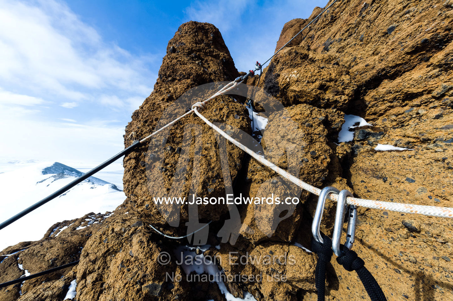 Carabiners on a climbing rope on a cliff overlooking the Ross Ice Shelf. Castle Rock, Hut Point Peninsula, Ross Island, Antarctica.