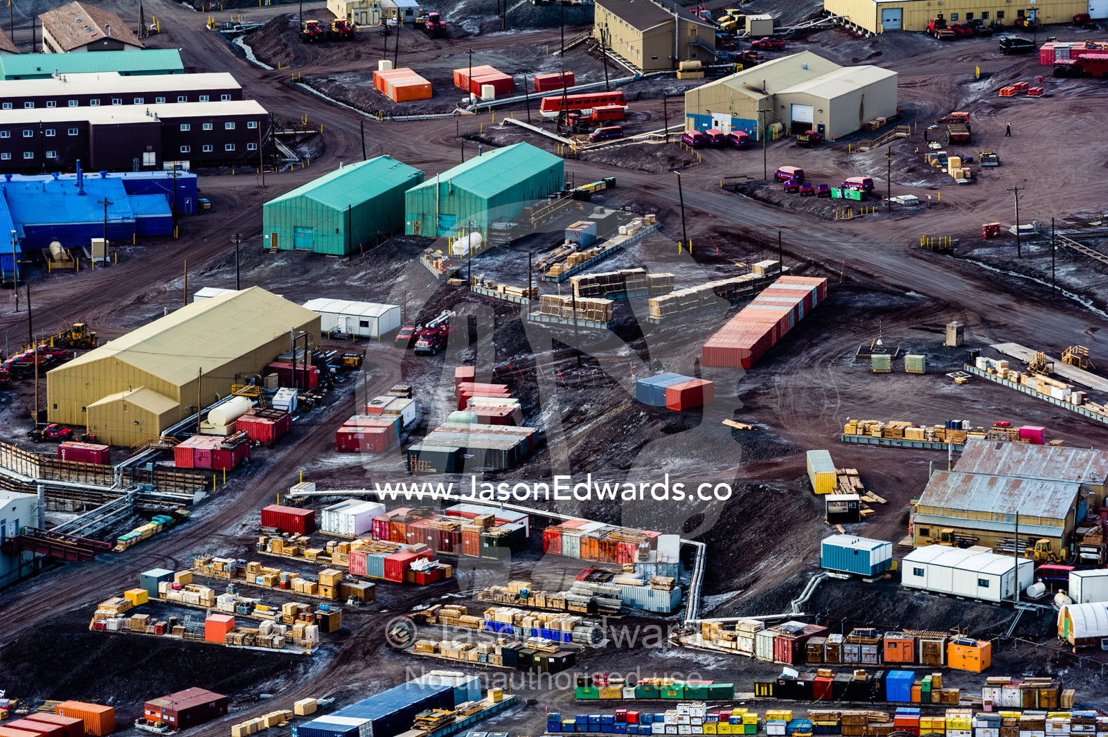 Shipping boxes and storage containers surround factories at McMurdo Station. McMurdo Station, Ross Island, Antarctica.