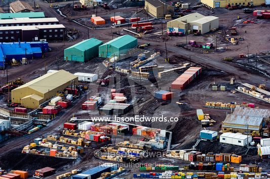 Shipping boxes and storage containers surround factories at McMurdo Station. McMurdo Station, Ross Island, Antarctica.