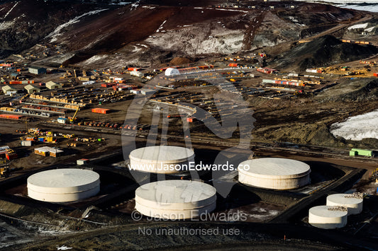The enormous oil tanks and sprawling facilities of McMurdo Station the largest base in Antarctica. McMurdo Station, Ross Island, Antarctica.