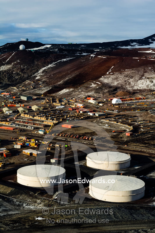 The enormous oil tanks and sprawling facilities of McMurdo Station the largest base in Antarctica. McMurdo Station, Ross Island, Antarctica.