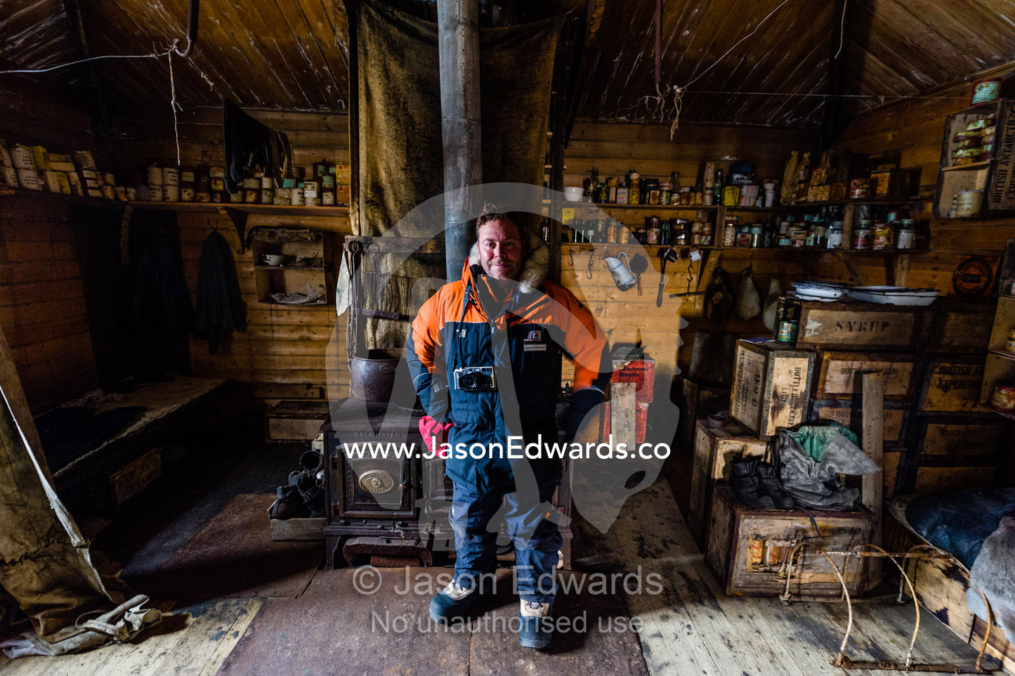 National Geographic photographer Jason Edwards in Ernest Shackleton's Hut in Antarctica. Shackleton's Hut, Cape Royds, Ross Island, Antarctica.