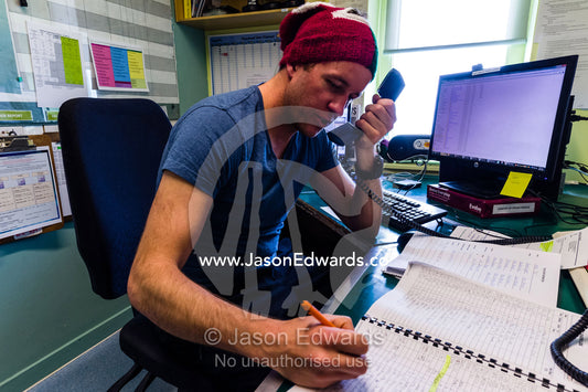 A radio operator in the communications room of an Antarctic base. Scott Base, Pram Point, Hut Point Peninsula, Ross Island, Antarctica.