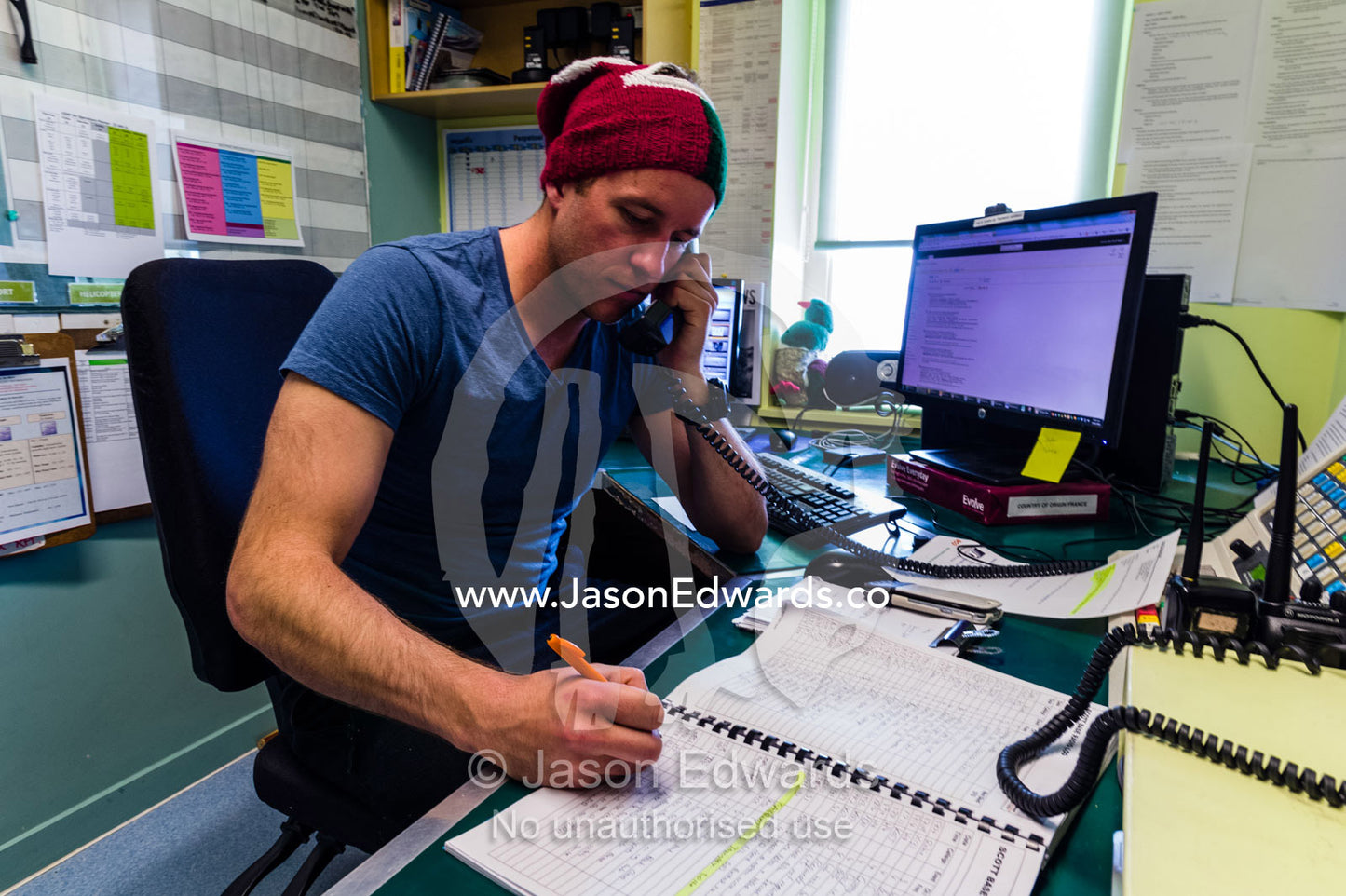 A radio operator in the communications room of an Antarctic base. Scott Base, Pram Point, Hut Point Peninsula, Ross Island, Antarctica.
