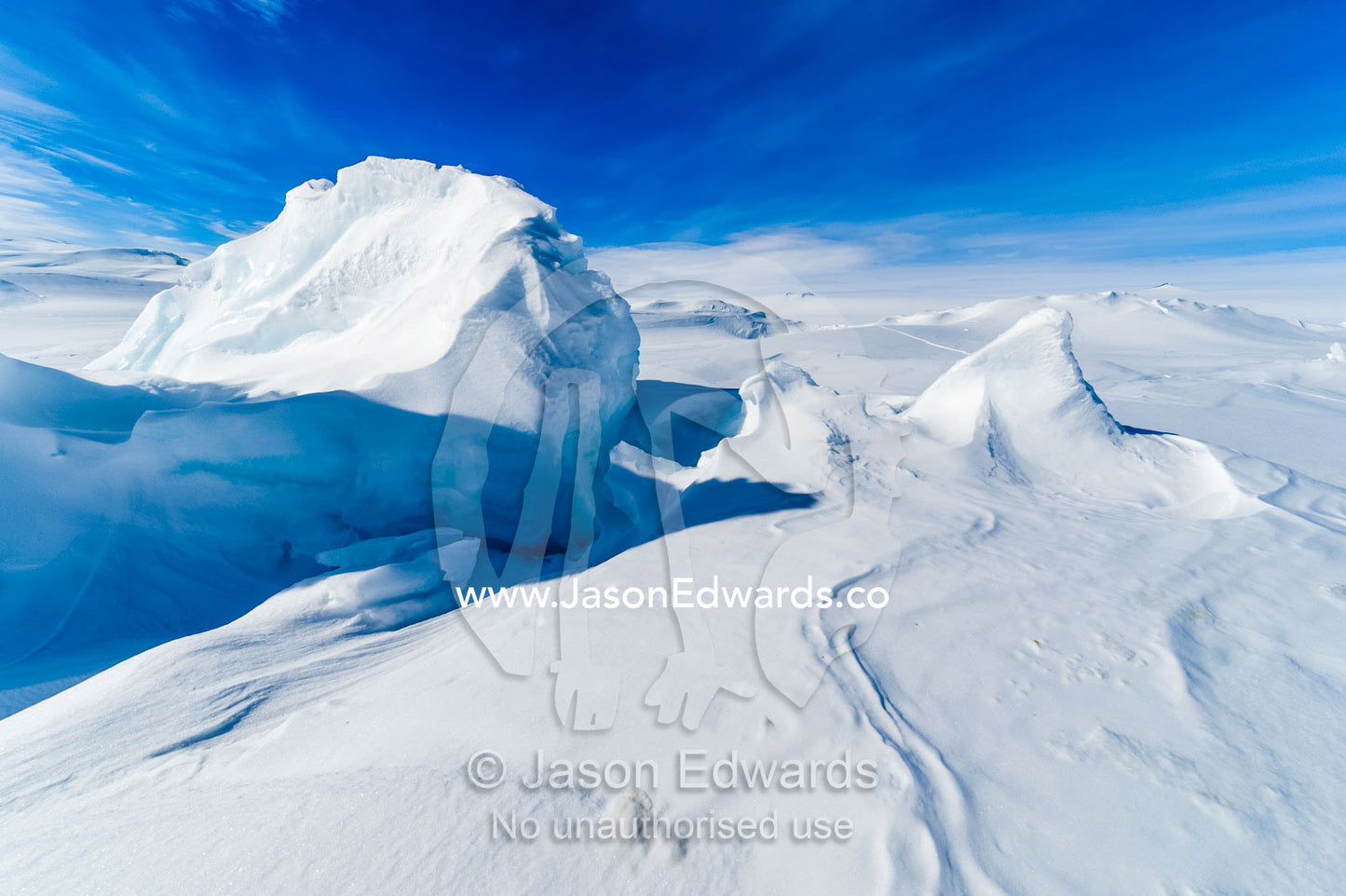 Snow drifts piled against pressure ridges in the sea ice. Turtle Rock, Erebus Bay, McMurdo Sound, Ross Island, Antarctica.