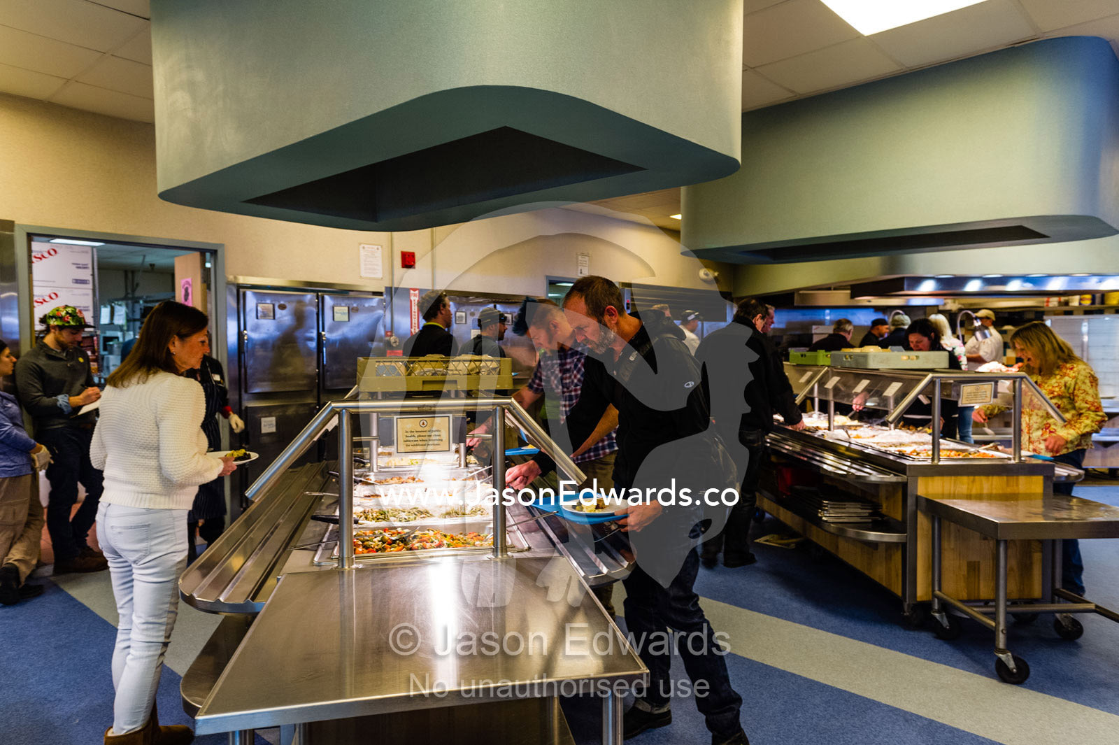 Antarctic staff gather food for Thanksgiving in a restaurant on an Antarctic base. McMurdo Station, Ross Island, Antarctica.