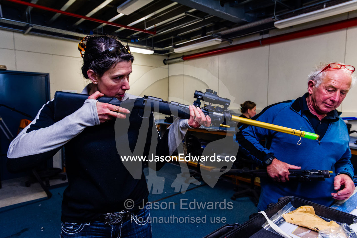 Scientists prepare a wildlife dart gun to be used to collect Killer Whale tissue samples. Scott Base, Pram Point, Hut Point Peninsula, Ross Island, Antarctica.