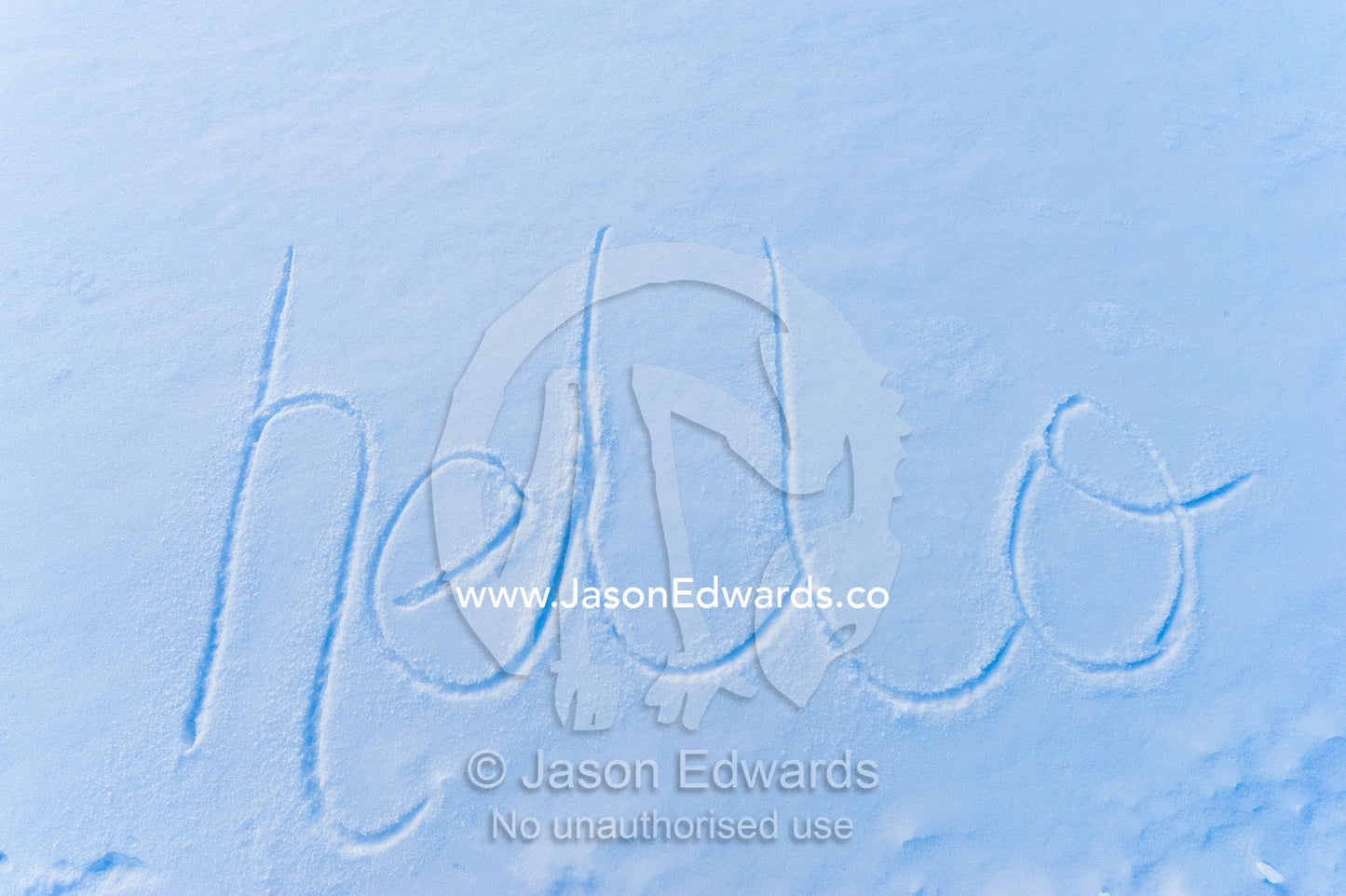 The word hello written in fresh snow on the sea ice. Pram Point, McMurdo Sound, Ross Island, Antarctica.