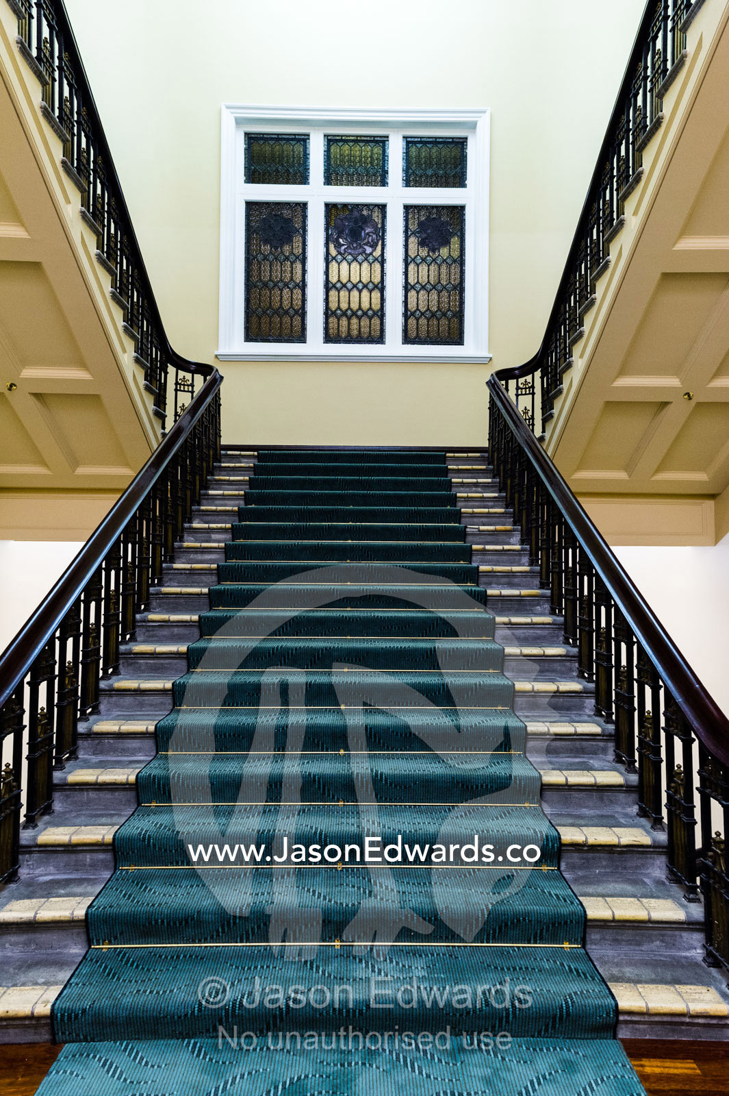 An elegant heritage stairwell and balustrade in a renovated hotel. Heritage Hotel Christchurch, Christchurch, New Zealand.