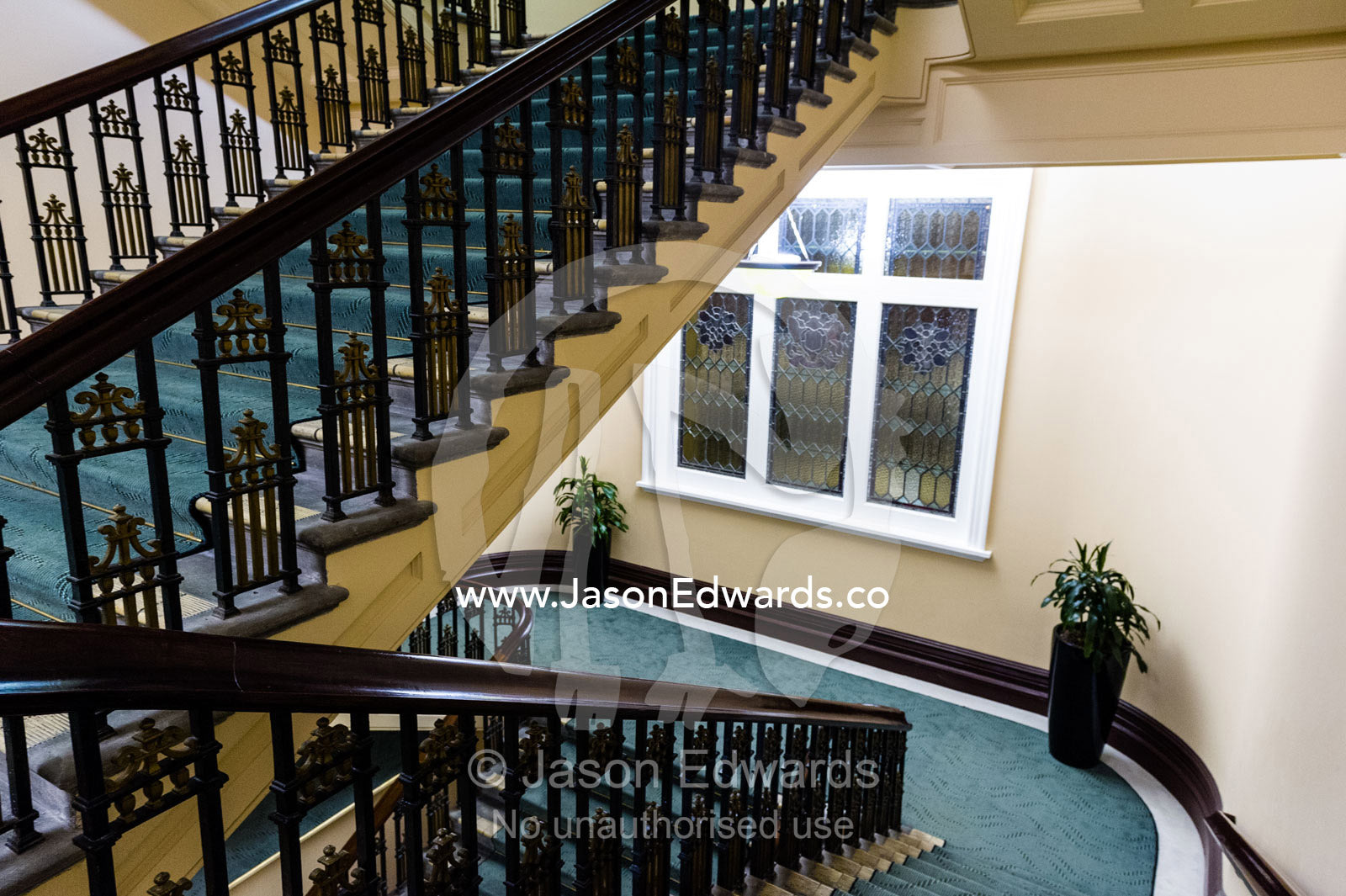 An elegant heritage stairwell and balustrade in a renovated hotel. Heritage Hotel Christchurch, Christchurch, New Zealand.