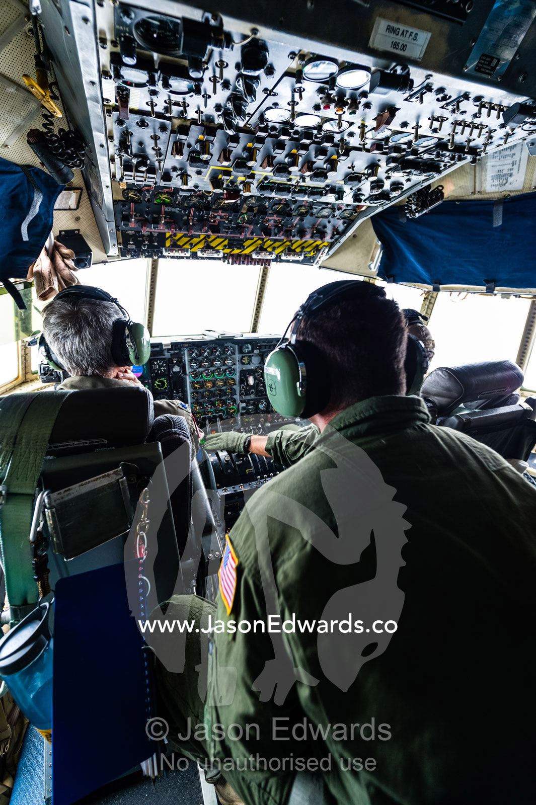 A US air force Hercules flight crew in the cockpit flying to Antarctica. Southern Ocean, between New Zealand and Antarctica.