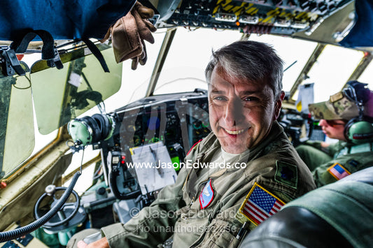 The pilot of a US air force Hercules flight crew in the cockpit flying to Antarctica. Southern Ocean, between New Zealand and Antarctica.