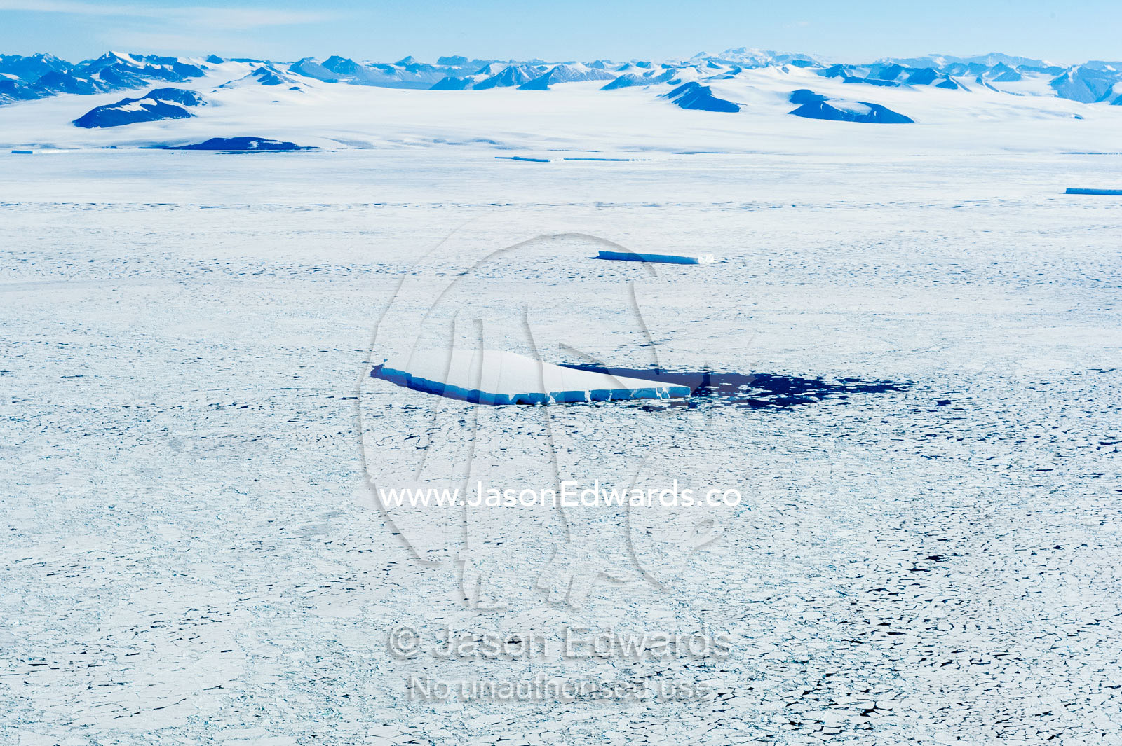 An iceberg trapped in platelet ice during the Antarctic summer. Ross Sea, Antarctica.