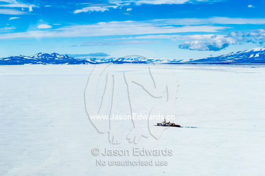 A Coast Guard icebreaker ploughs it's way through sea ice in Antarctica. McMurdo Sound, Ross Sea, Antarctica.