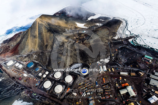 The view of McMurdo Station beneath Observation Hill through the cockpit of a US Air force Hercules cockpit. McMurdo Station, Ross Island, Antarctica.