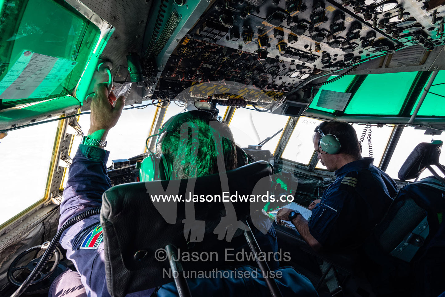 The South African flight crew of a US Air force Hercules in the cockpit. Transantarctic Mountains, Northern Victoria Land, Antarctica.