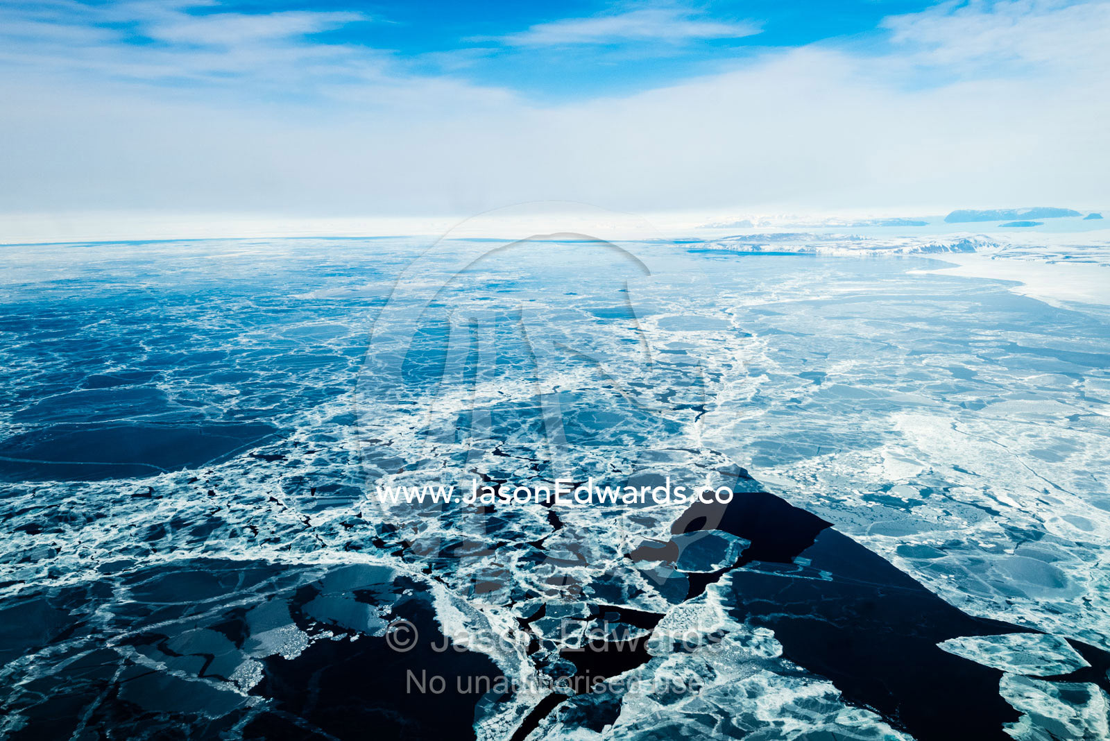 An aerial view of sea ice melting into a mosaic of patterns during the Antarctic summer. Terra Nova Bay, Victoria Land, Antarctica.