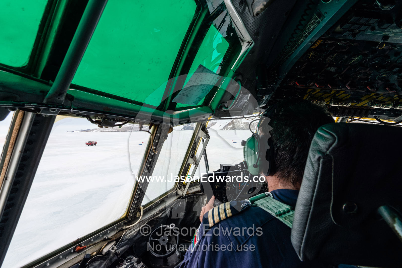 The South African pilot of a US Air force Hercules waiting on an ice runway to takeoff. Zucchelli Station, Terra Nova Bay, Victoria Land, Antarctica.