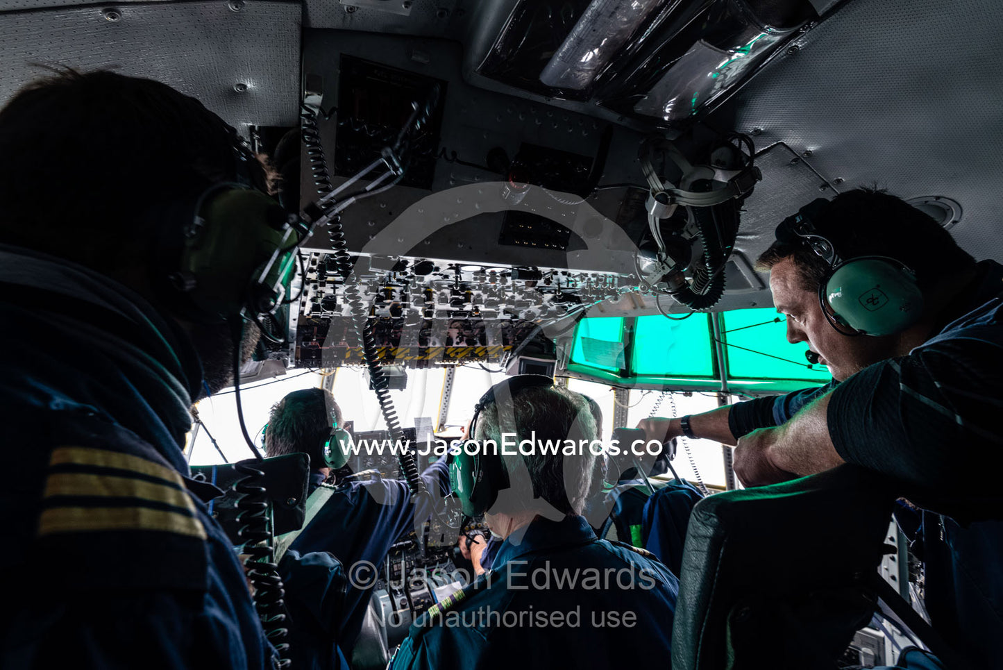 The South African flight crew of a US Air force Hercules in the cockpit preparing to land in Antarctica. Pegasus Field, Ross Island, McMurdo Sound, Antarctica.