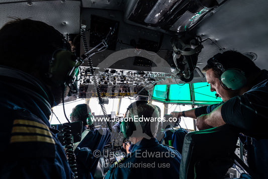 The South African flight crew of a US Air force Hercules in the cockpit preparing to land in Antarctica. Pegasus Field, Ross Island, McMurdo Sound, Antarctica.