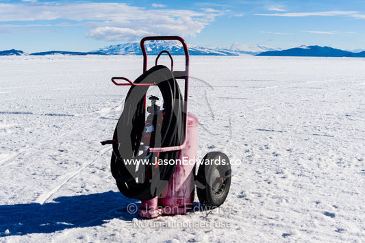 A fire extinguisher rests on the sea ice for refueling air force planes. Royal Society Range, Pegasus Field, McMurdo Ice Shelf, Ross Island, McMurdo Sound, Antarctica.