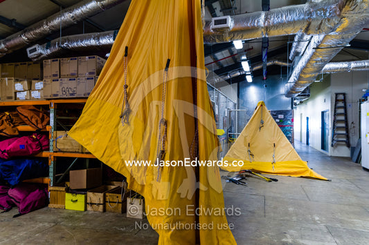 Bright yellow survival training course tents drying in an Antarctic base. Scott Base, Pram Point, Hut Point Peninsula, Ross Island, Antarctica.