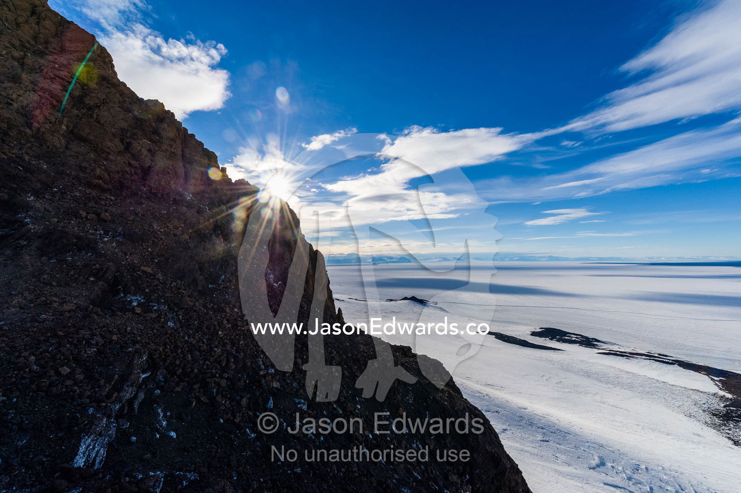 The frozen sea ice and expanding ocean ice edge during the Antarctic summer. Castle Rock, Hut Point Peninsula, Ross Island, Antarctica.
