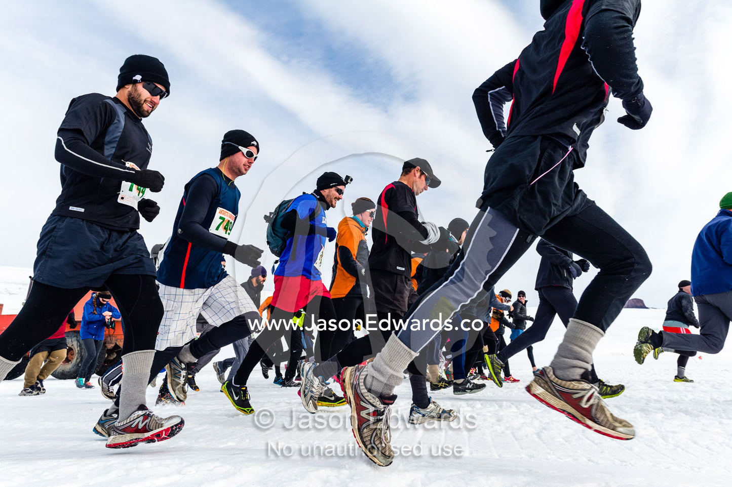 Runners from the Antarctic bases cross the sea ice during the Antarctic marathon. Ross Ice Shelf, Ross Island, Antarctica.