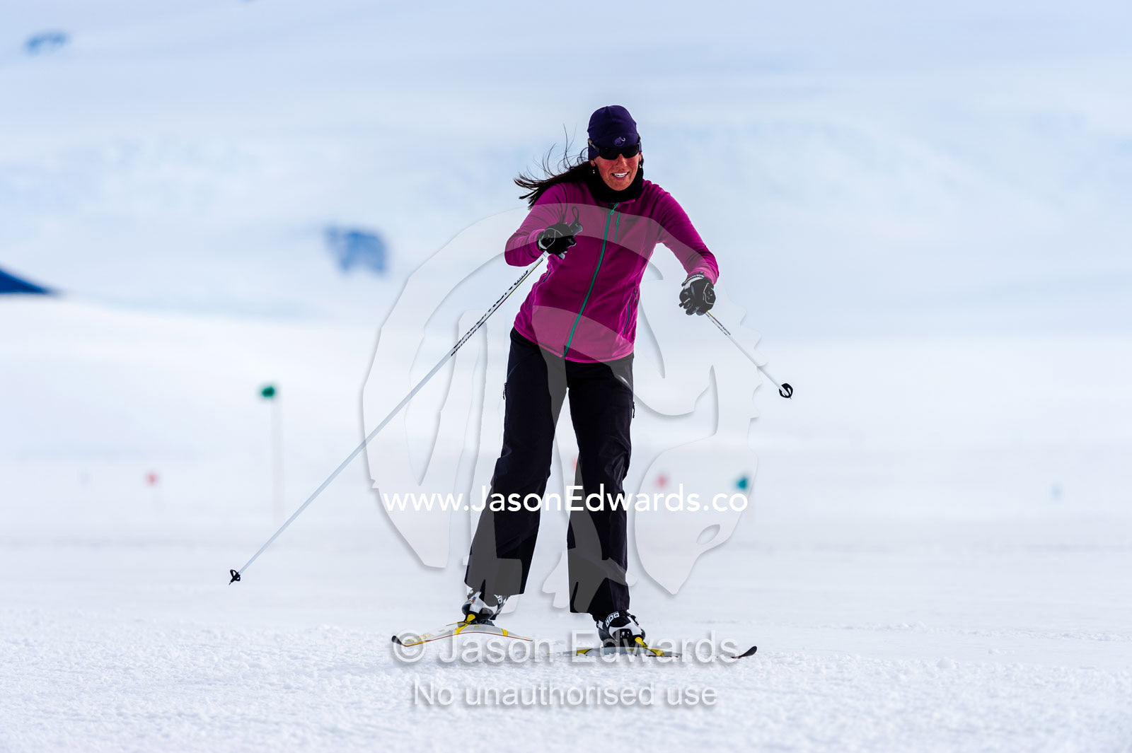 A solitary cross-country Nordic skier crosses the sea ice during the Antarctic marathon. Ross Ice Shelf, Ross Island, Antarctica.