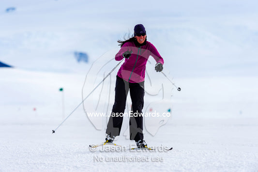 A solitary cross-country Nordic skier crosses the sea ice during the Antarctic marathon. Ross Ice Shelf, Ross Island, Antarctica.