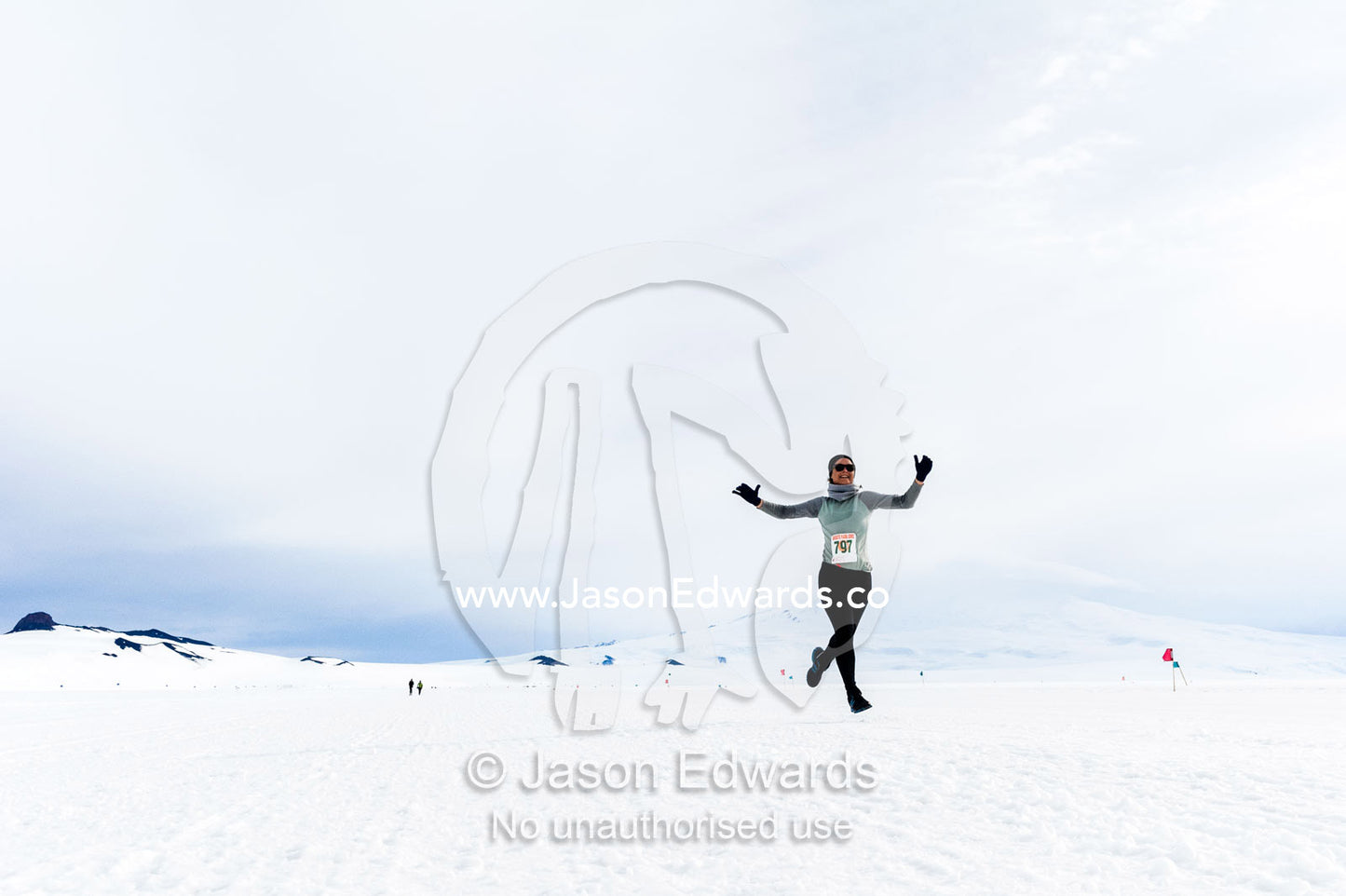 A solitary runner crosses the sea ice during the Antarctic marathon. Ross Ice Shelf, Ross Island, Antarctica.