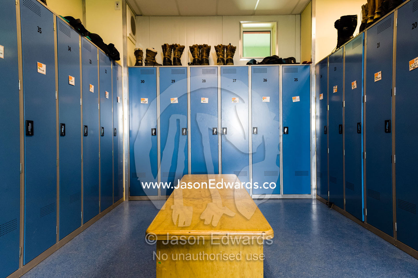 Clothing lockers and extreme cold weather ice boots in a change room in Antarctica. Scott Base, Pram Point, Hut Point Peninsula, Ross Island, Antarctica.