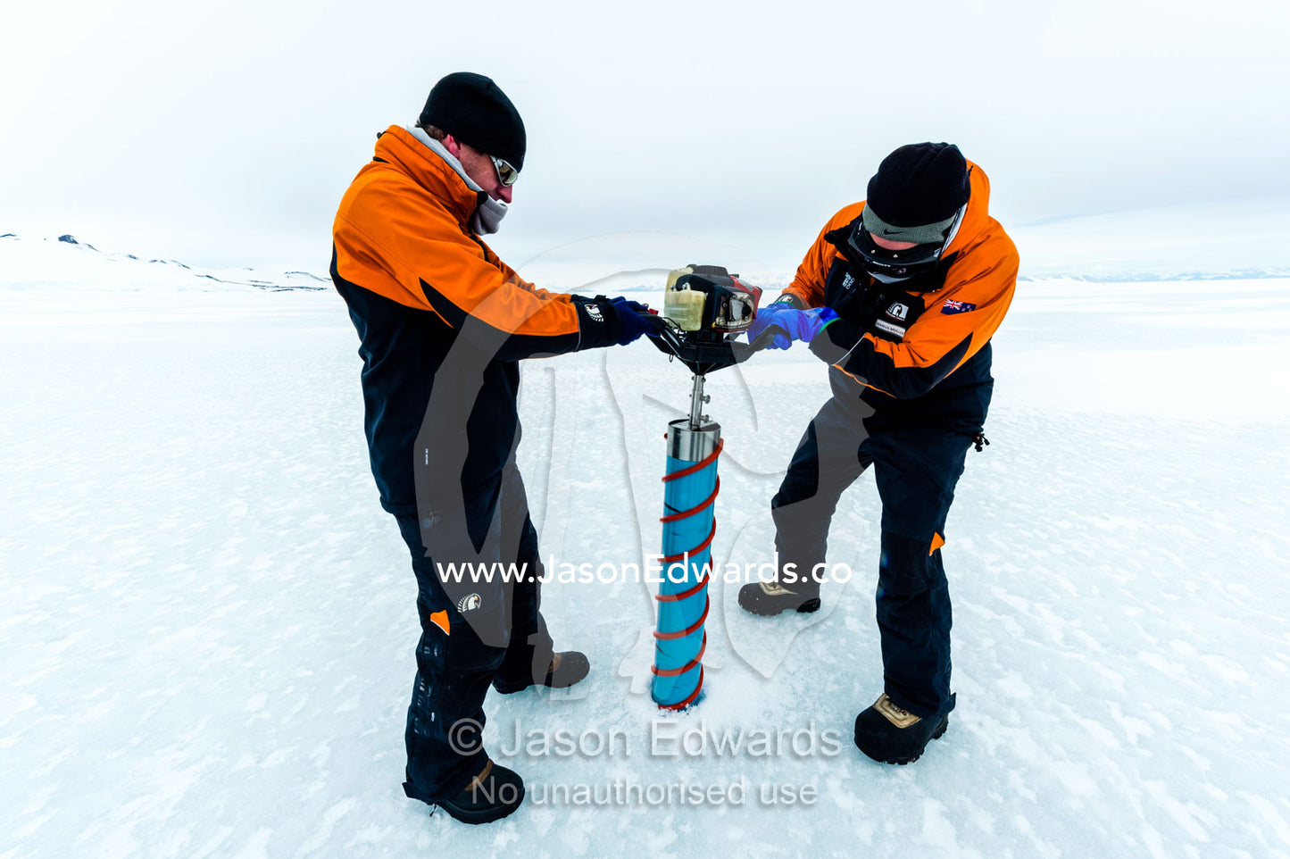 Researchers drill core samples from the sea ice to collect extremophiles from beneath the ice to study. Turtle Rock, Erebus Bay, McMurdo Sound, Ross Island, Antarctica.
