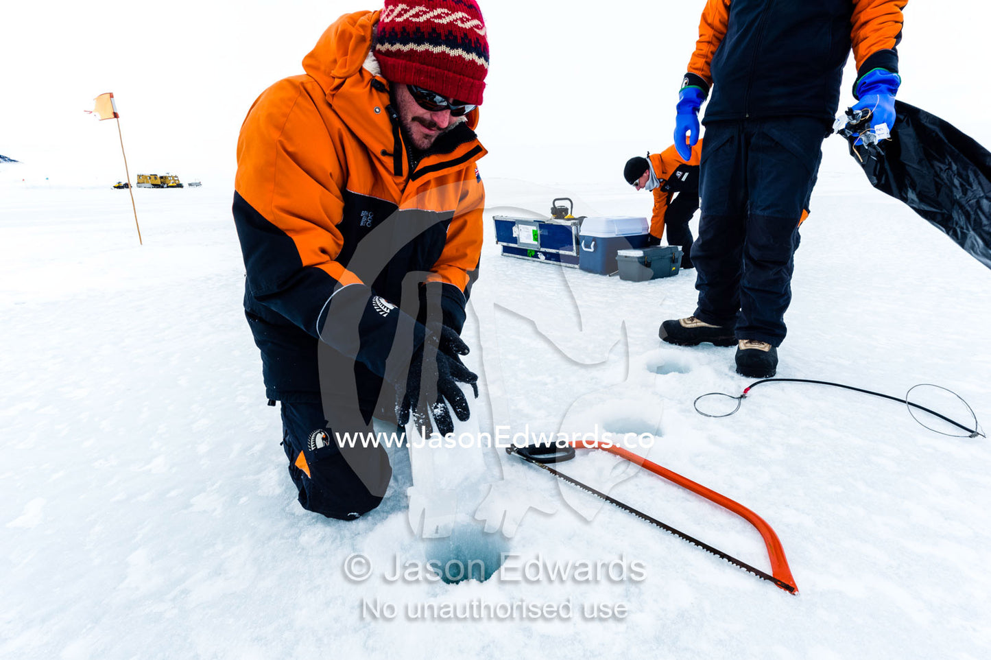 Researchers drill core samples from the sea ice to collect extremophiles from beneath the ice to study. Turtle Rock, Erebus Bay, McMurdo Sound, Ross Island, Antarctica.