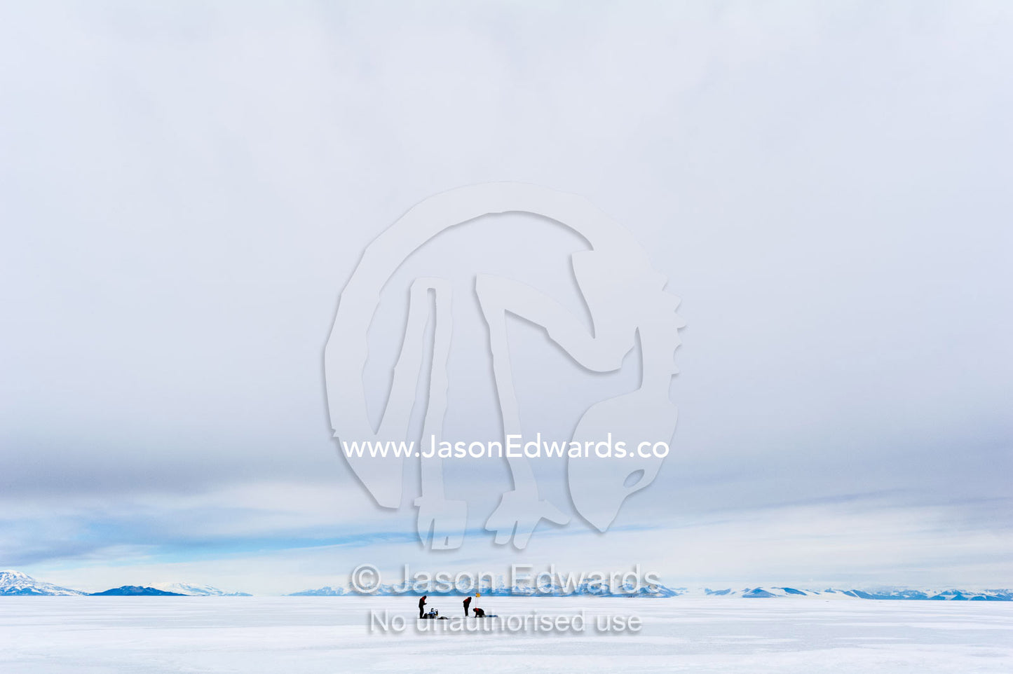 On the vast sea ice researchers drill core samples to collect extremophiles from beneath the ice to study. Turtle Rock, Erebus Bay, McMurdo Sound, Ross Island, Antarctica.